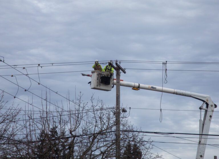 Workers repair a power line damaged by a Whatcom Transportation Authority bus Feb. 9 in Ferndale.
