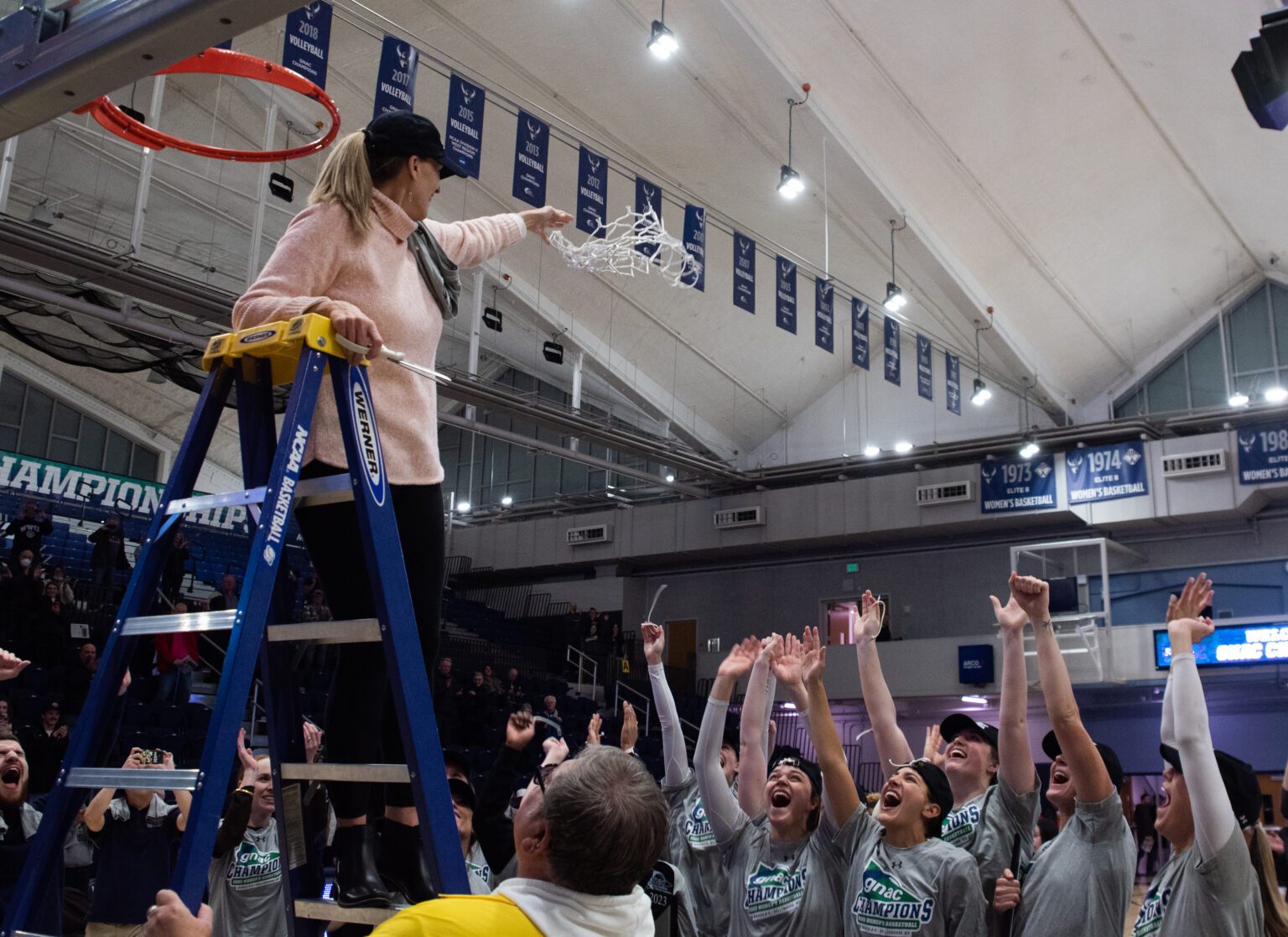 Western Washington University head women's basketball coach Carmen Dolfo cuts the net March 4 after the Vikings defeated Montana State University Billings 76-71 to clinch the Great Northwest Athletic Conference championship at Carver Gymnasium. Dolfo leads the Vikings into NCAA Division II Tournament play Friday in Carson