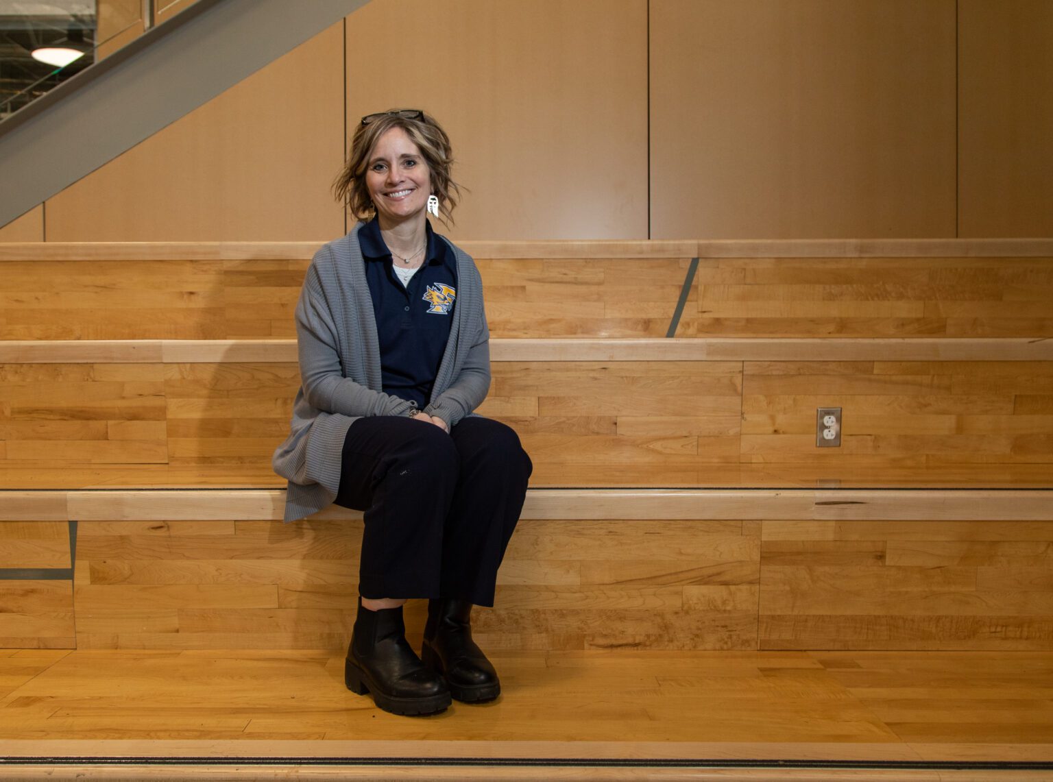 Ferndale School District Superintendent Kristi Dominguez sits on the stairs of the new Ferndale High School commons. She said there is a perception that superintendents spend most of their time in the office