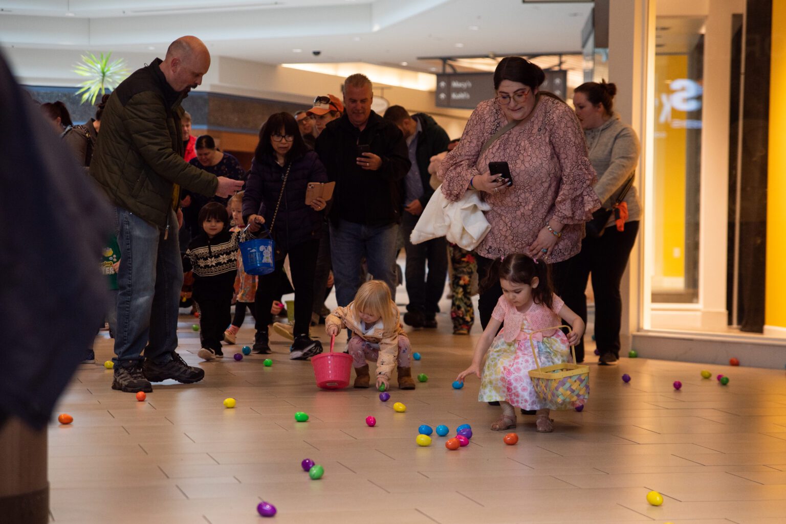 Children pick up Easter eggs at Bellis Fair April 8 during the mall's Easter egg hunt. Hundreds of kids showed up to search for 5