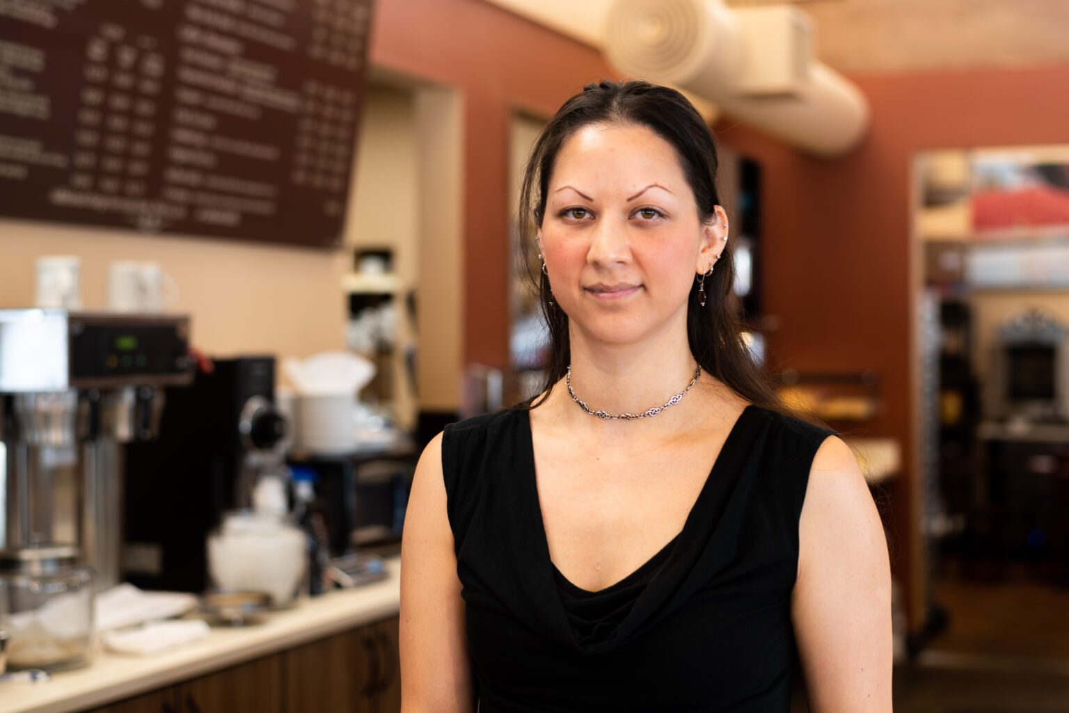 Dianna Del Giorgio stands behind the counter of Caffé Adagio. She has owned and worked at the cafe