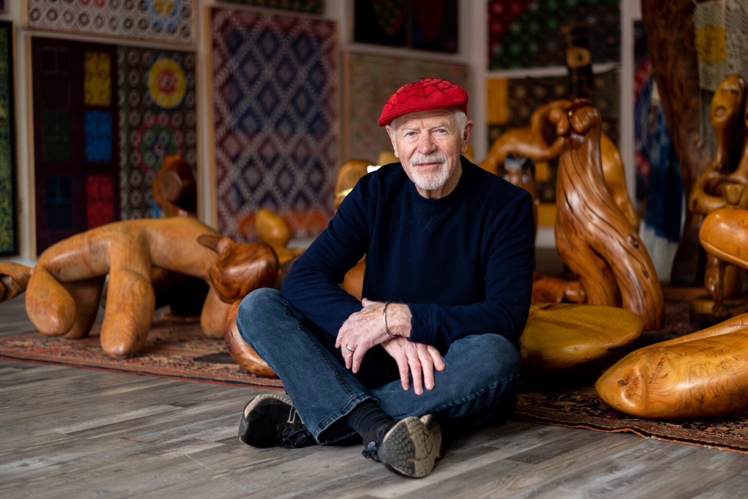 Francis X. Donovan sits on the floor of his pop-up gallery in McKenzie Alley in Fairhaven. His show