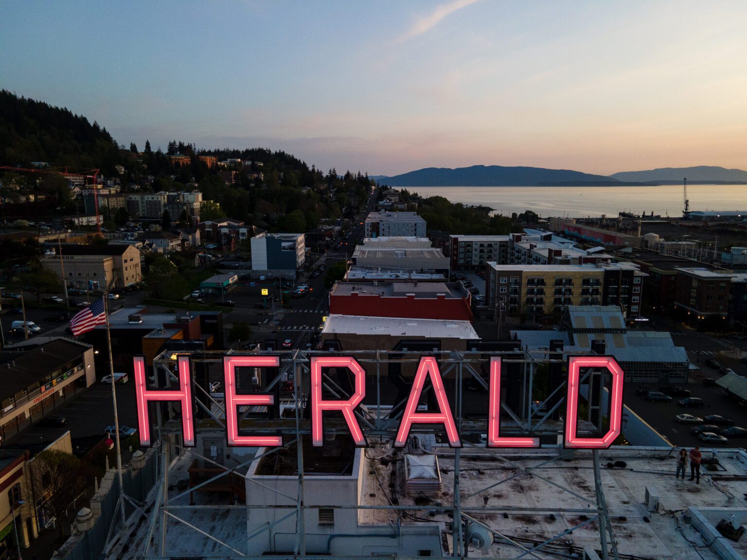 The Herald sign glows red over downtown Bellingham at sunset May 3.