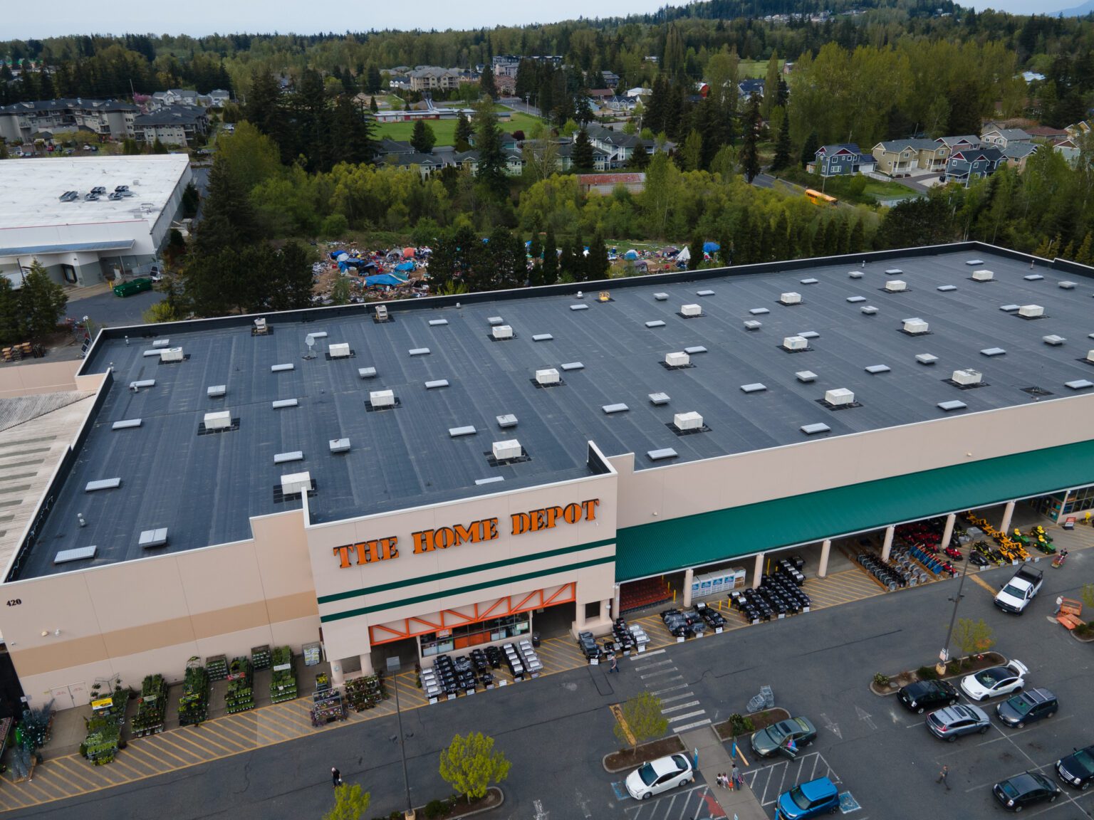 A homeless encampment is visible behind the Home Depot in Bellingham on May 4. City officials say an organized crime ring operates at the camp