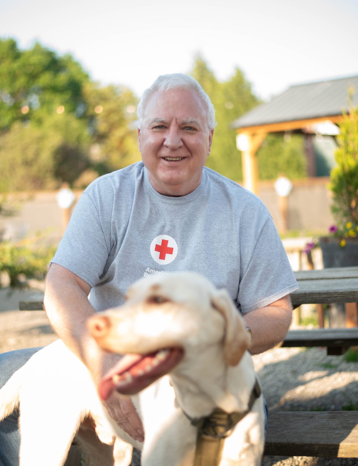 Bob Hungerschafer holds his dog Kirin. He has donated blood more than 1