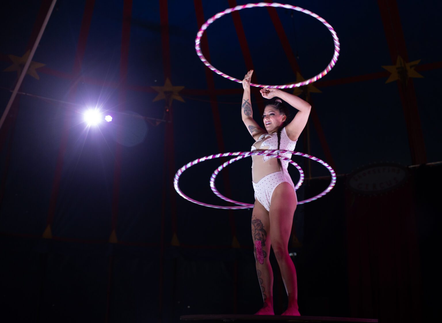 The Flying Brain — Stephanie Little Thunder Morphet-Tepp — performs with hula hoops May 18 onstage at the Shoestring Circus. The new circus will continue Friday