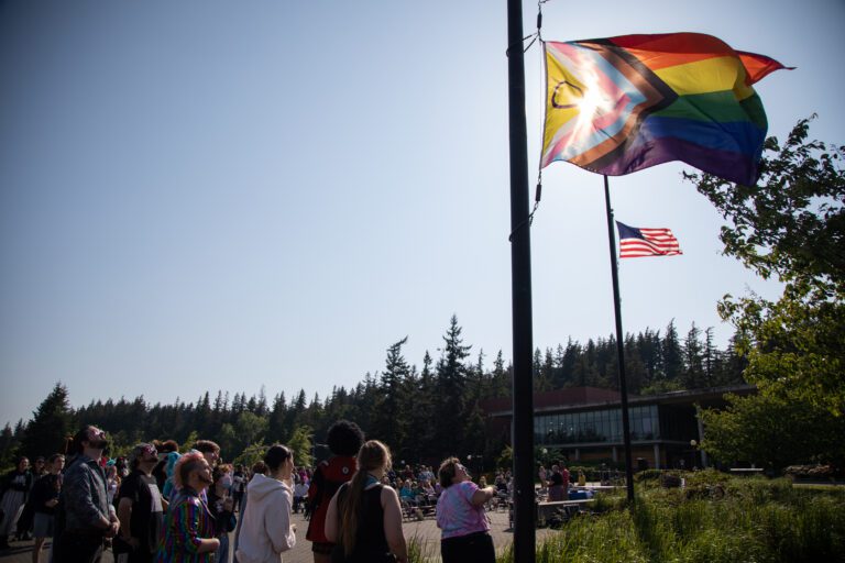 Western Washington University students raise up a Pride flag May 31. The university hosted a Pride event to celebrate LGBTQ+ students.