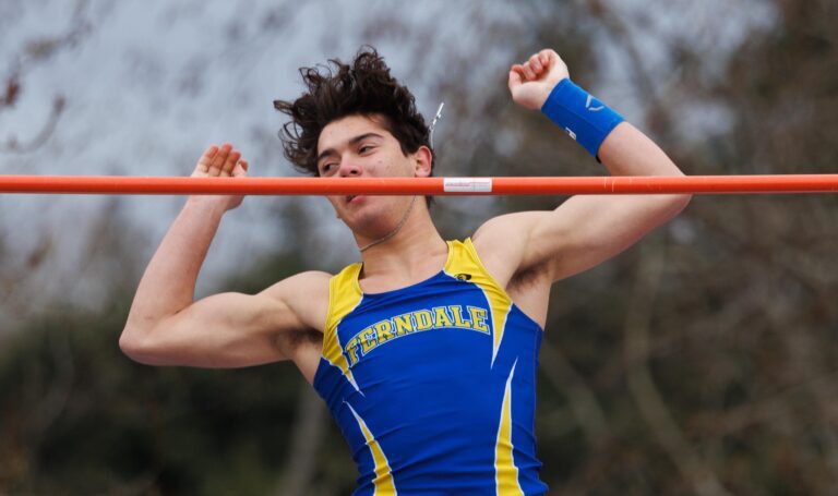 Ferndale's Adrian Finsrud watches the bar as he clears 12 feet in the boys pole vault April 8 during the Birger Solberg Invitational track meet at Civic Stadium. Finsrud tied for first place with his brother