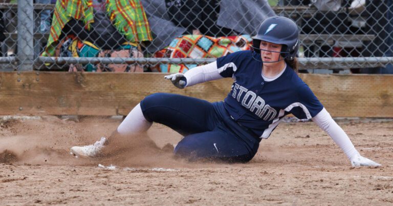 Squalicum’s Olivia Paoli slides safely into home plate for the run as the Storm beat Ferndale 3-0 in a fastpitch softball game on April 13