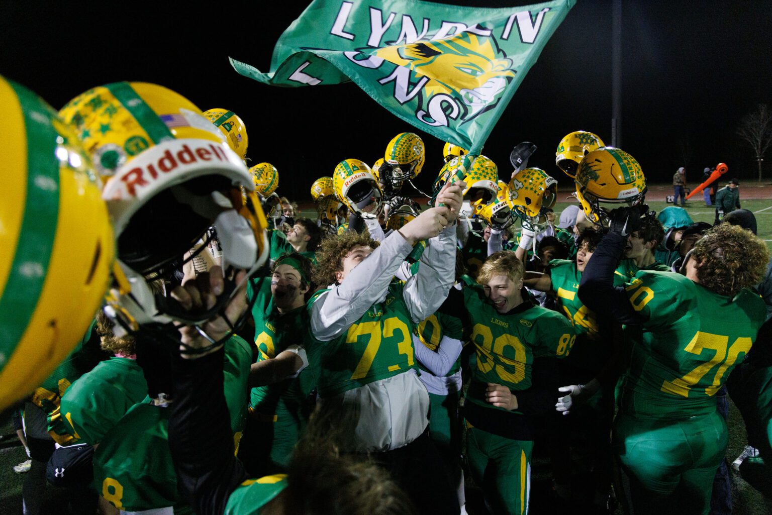 Lynden players celebrate after beating Enumclaw 41-14 in a state semifinal game on Nov. 26. The Lions advanced to the 2A state championship on Dec. 3.