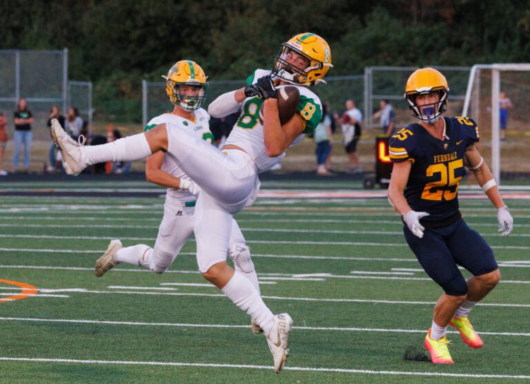 Lynden's Isaiah Stanley intercepts a pass intended for Ferndale’s Conner Walcker in the first quarter. Lynden beat Ferndale 24-7 at Blaine High School on Friday night.