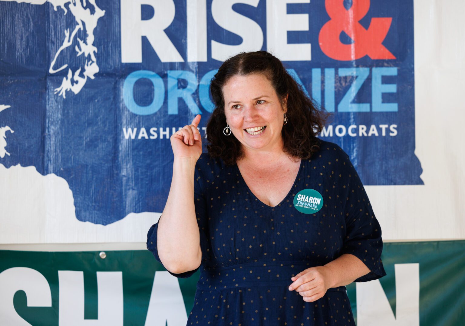 Washington state Senate candidate Sharon Shewmake talks to supporters in Bellingham before knocking on doors to get out the vote on July 27. Two conservative political action committees have targeted Shewmake with more than $184