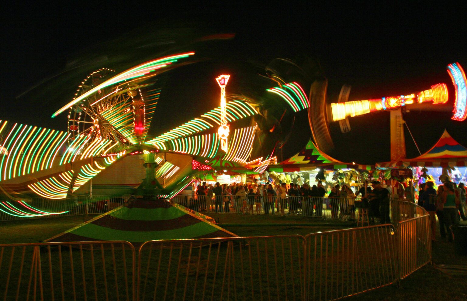 The midway at the Northwest Washington Fair in Lynden is a popular nighttime gathering spot for thrill-seeking carnival ride fans