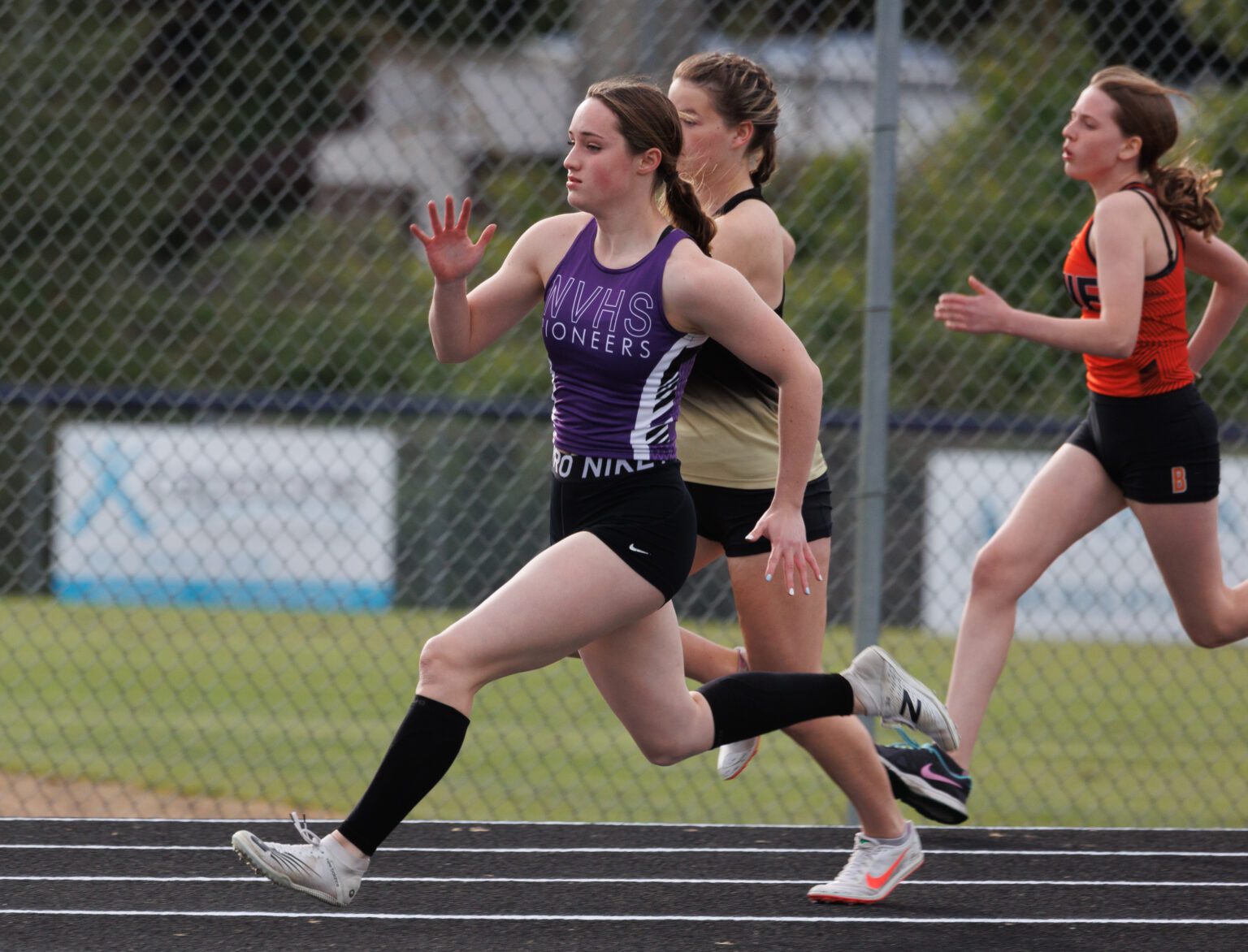 Nooksack Valley's Kate Desilets overtakes her competitors in the 200-meter run during the 1A District 1 track meet at Lynden Christian High School on May 11.