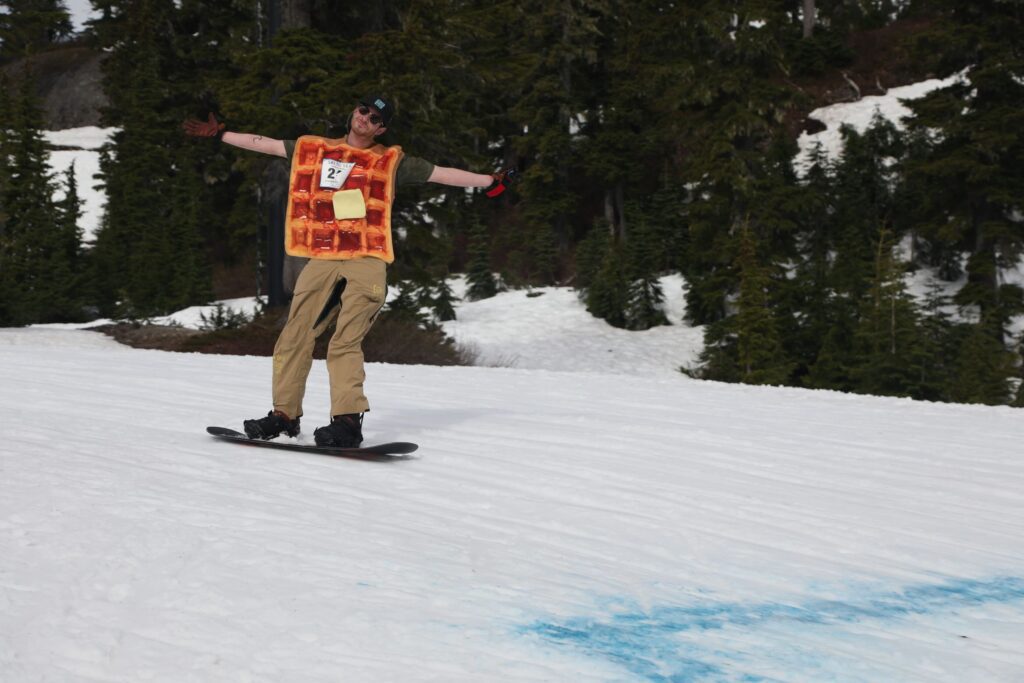 Nate Brown of Sweet As Waffles poses in his waffle costume as he snowboards down in the second leg.