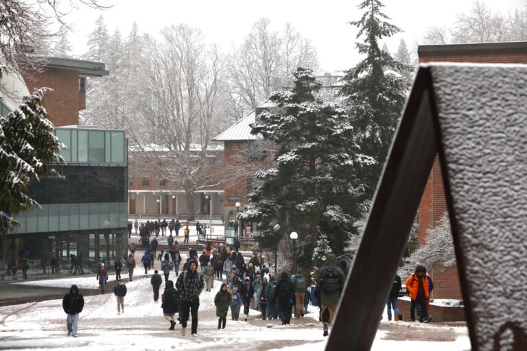 Students walk through slush in between classes on Western Washington University's campus Feb. 28. A winter weather advisory is in effect until noon for Whatcom County.