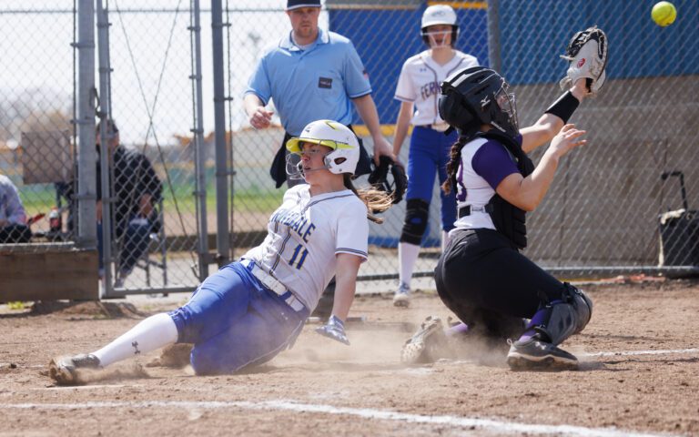 Ferndale's Mallory Butenschoen slides into home plate ahead of the throw as Ferndale beat Friday Harbor 16-3.