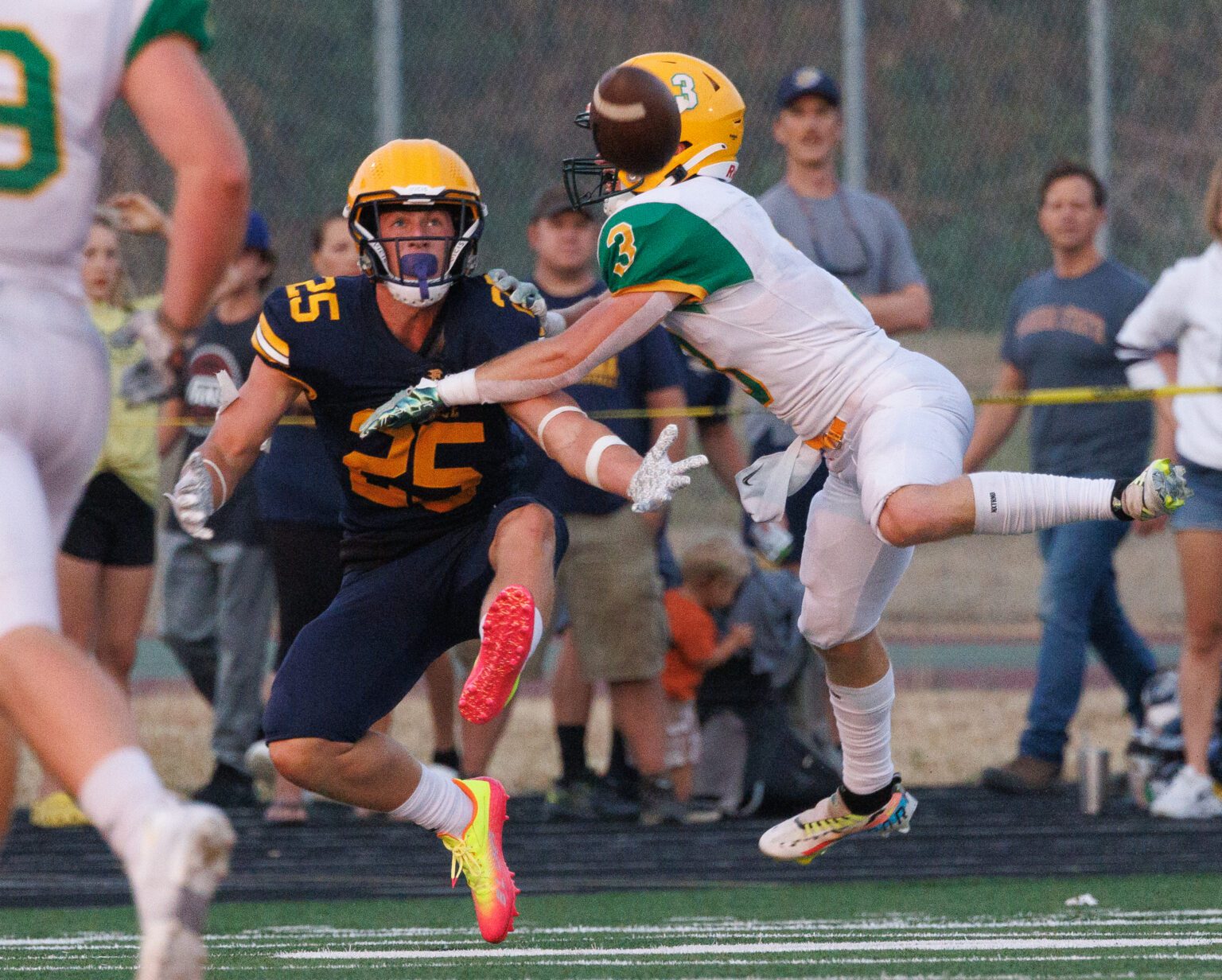 Lynden’s Kaeden Hermanutz breaks up a pass intended for Ferndale's Conner Walcker but is called for defensive pass interference on the play. The Lions beat Ferndale 24-7 at Blaine High School on Friday night.