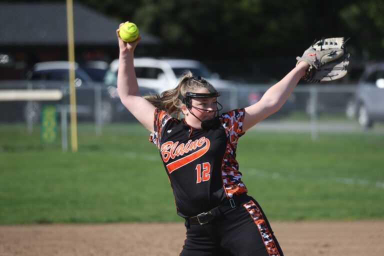 Blaine pitcher Emersyn Bakker winds up for a pitch as she leans for a stronger throw.
