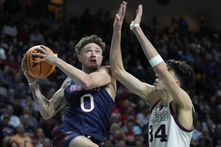 Saint Mary's Logan Johnson (0) shoots against Gonzaga's Chet Holmgren (34) during the second half of an NCAA college basketball championship game at the West Coast Conference tournament Tuesday
