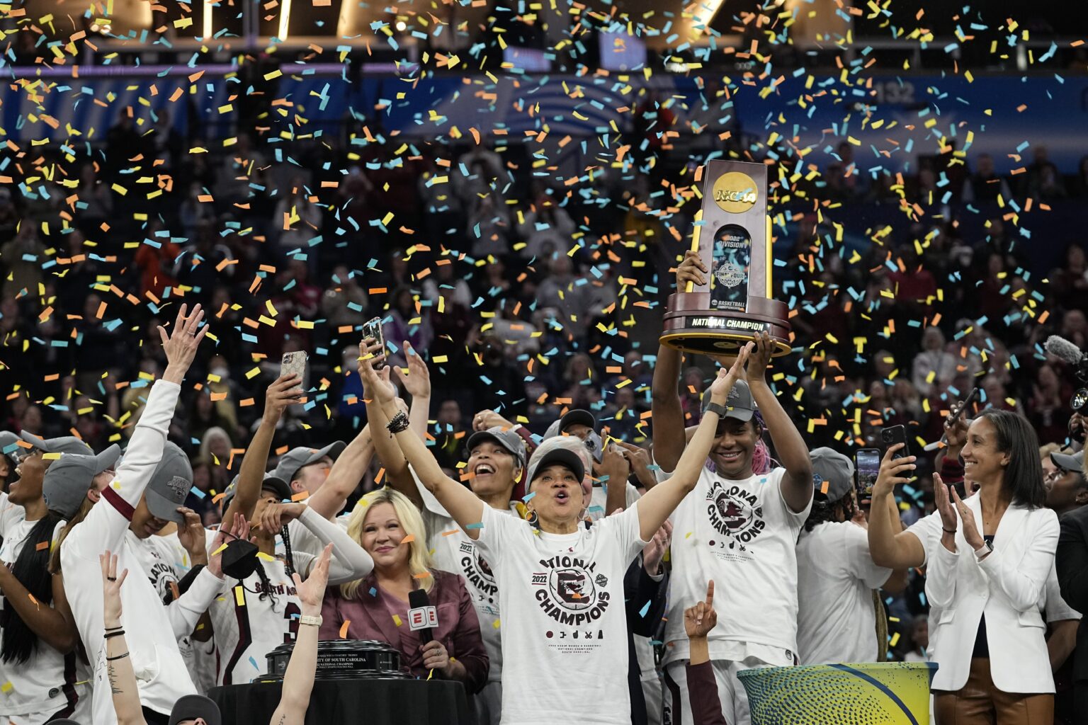 South Carolina head coach Dawn Staley celebrates with her team after a college basketball game in the final round of the Women's Final Four NCAA tournament against UConn Sunday