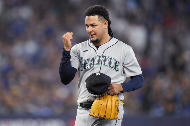 Seattle Mariners starting pitcher Luis Castillo clenches his fist as he leaves during the eighth inning against the Toronto Blue Jays in Game 1 of a baseball AL wild-card series in Toronto on Oct. 7.