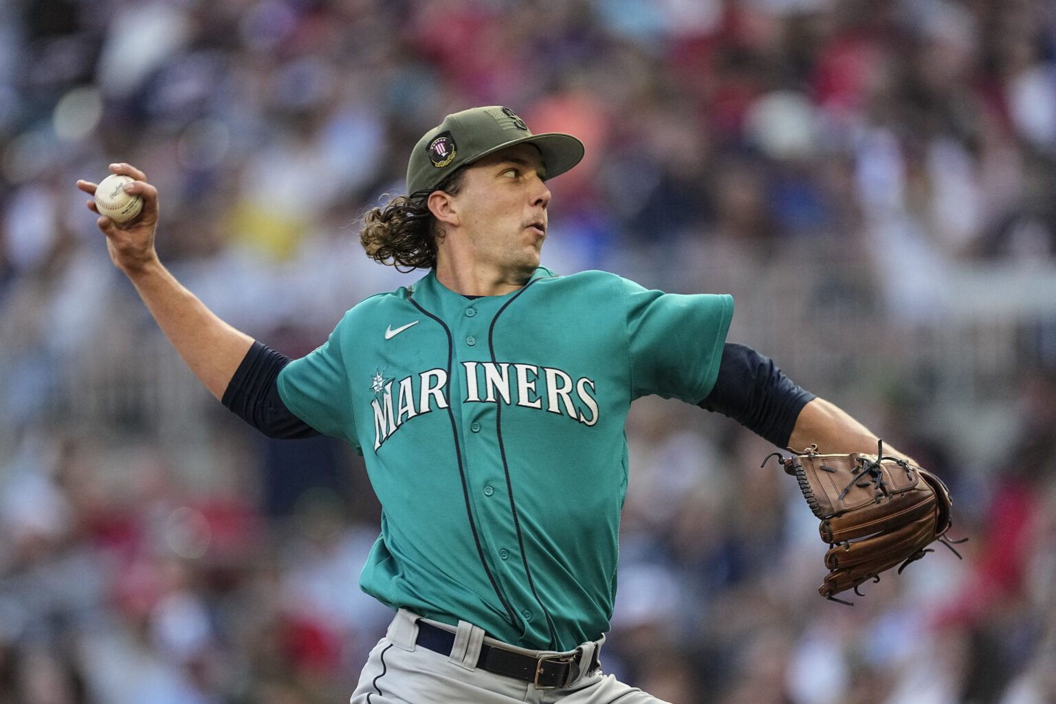 Seattle Mariners starting pitcher Logan Gilbert works against the Atlanta Braves in the first inning of a baseball game