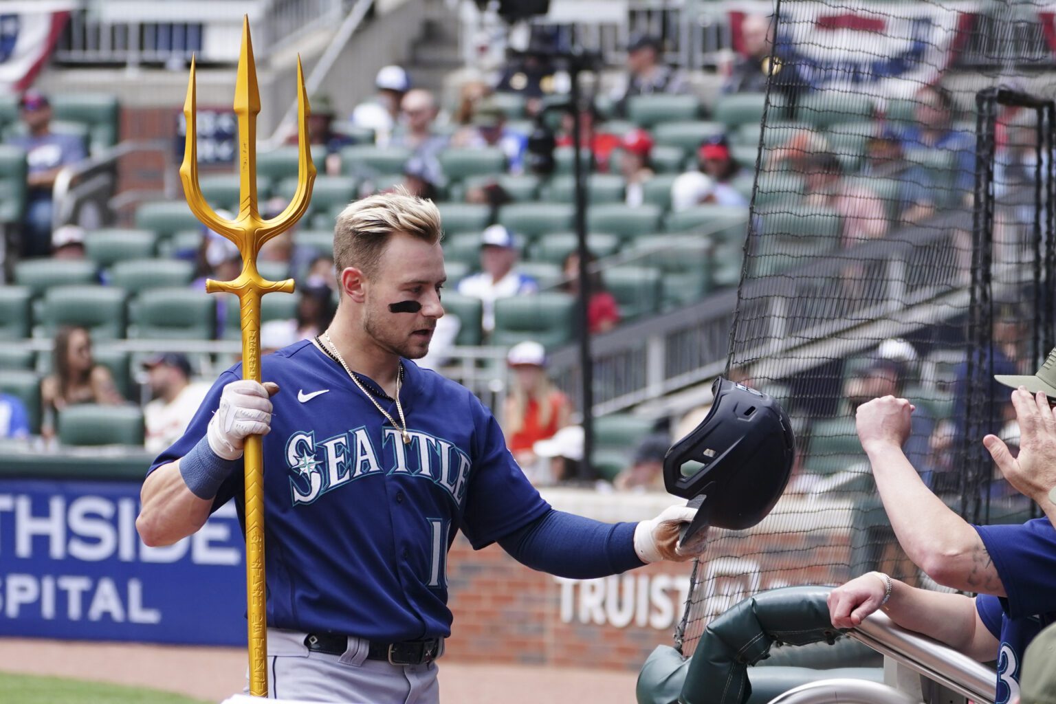 Seattle Mariners' Jarred Kelenic is greeted at the dugout May 21 after hitting a solo home run in the second inning against the Atlanta Braves in Atlanta.