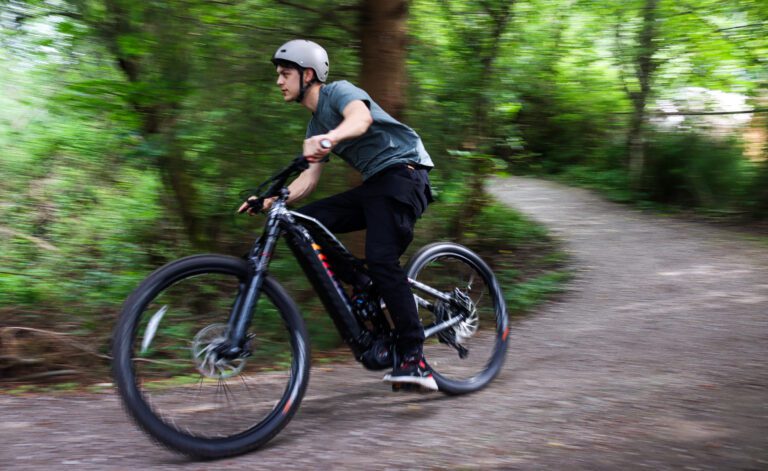 Michael Rodriguez rides an electric mountain bike on a trail in Fairhaven on June 4. This Seattle Electric Bike is designed to provide varying levels of pedal assistance depending on what the rider selects.