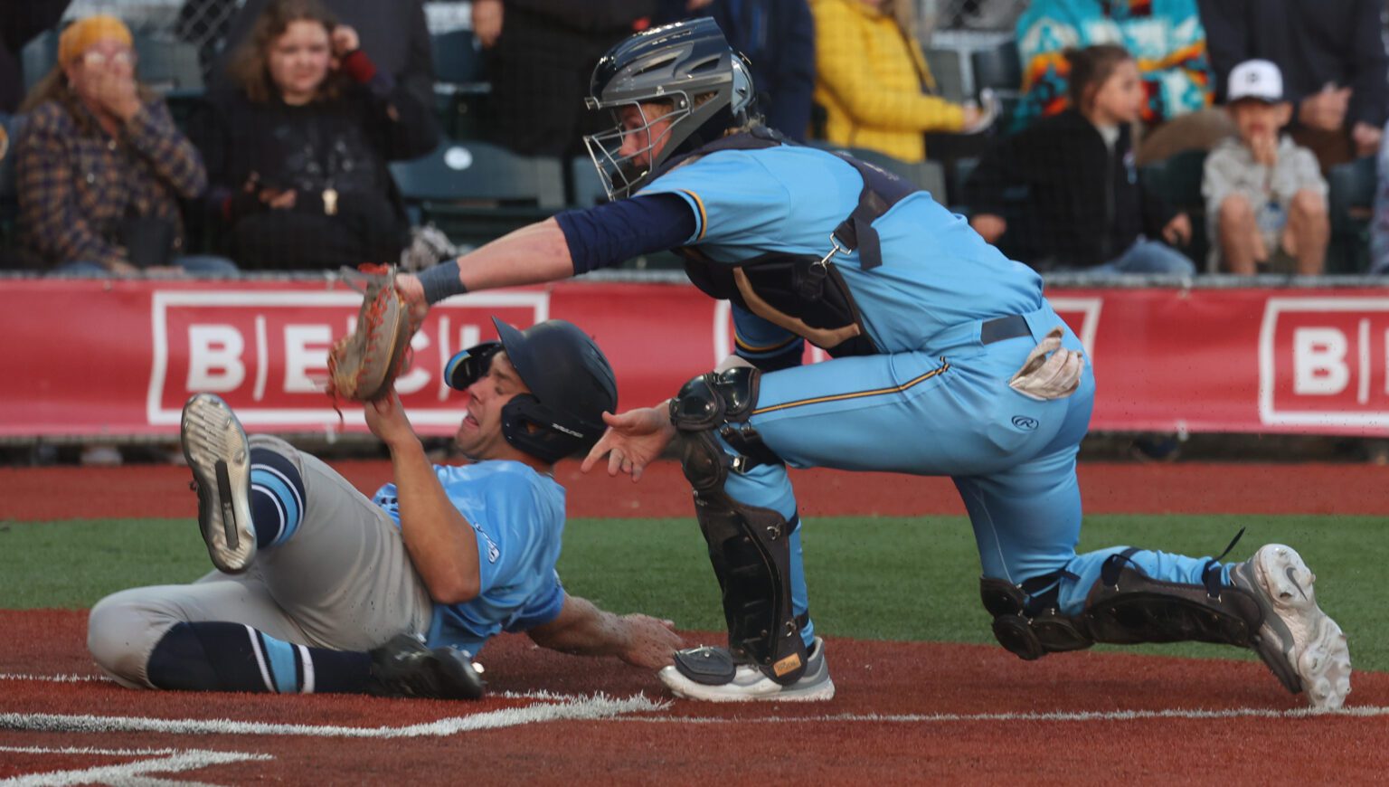 Bellingham Bells' catcher Cole Williams gets the tag at home plate June 2 to seal a 2-1 win over the Edmonton Riverhawks on opening day at Joe Martin Stadium.