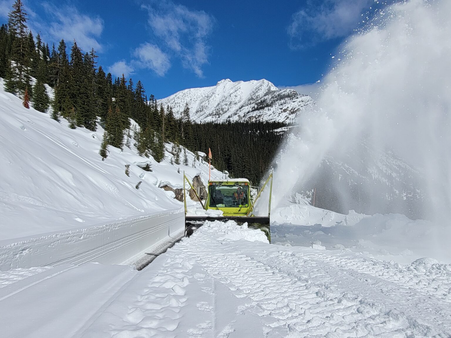 A state Department of Transportation worker removes snow from North Cascades Highway on April 12. The highway will open to vehicles on May 10.