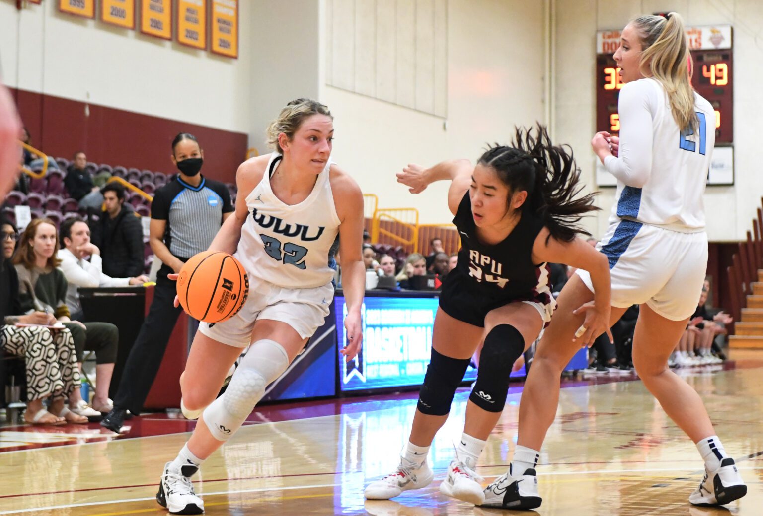 Western senior Mollie Olson drives against an Azusa Pacific defender March 10 during the Vikings' season-ending 71-53 loss in the NCAA Divison II West Regional Tournament in Carson