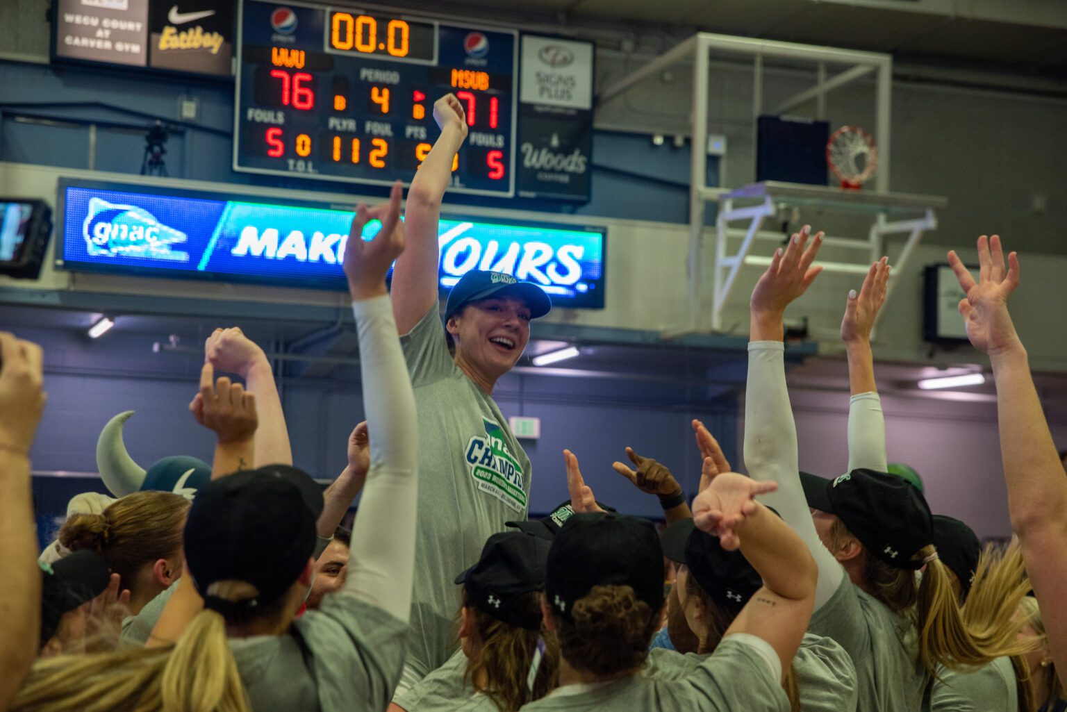Western Washington University's Brooke Walling is hoisted into the air March 4 after the Vikings defeated Montana State University Billings 76-71 to clinch the Great Northwest Athletic Conference championship at Carver Gymnasium.