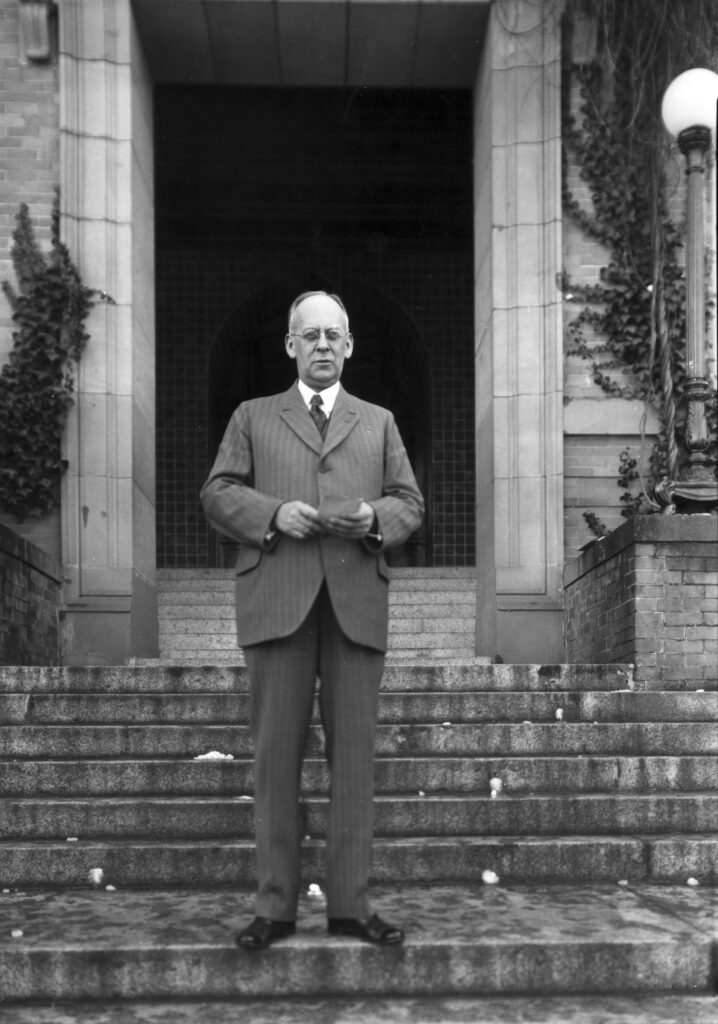 Charles H. Fisher, on the steps of Old Main, 1933.