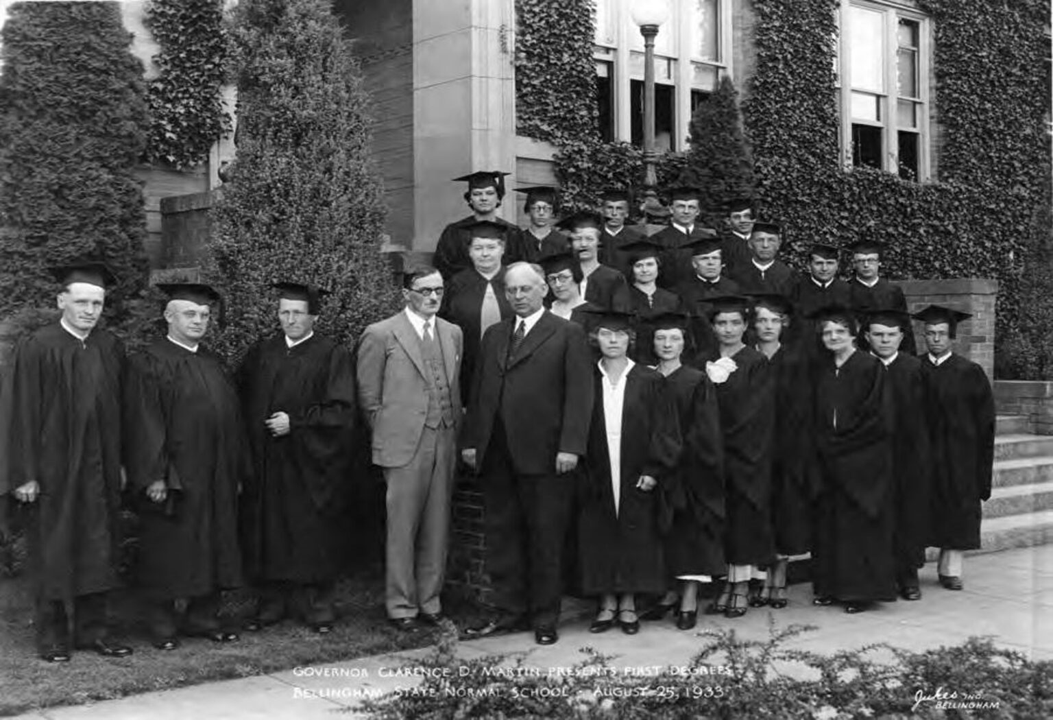 Western President Charles Fisher standing with the graduating class of 1933 in front of the campus.