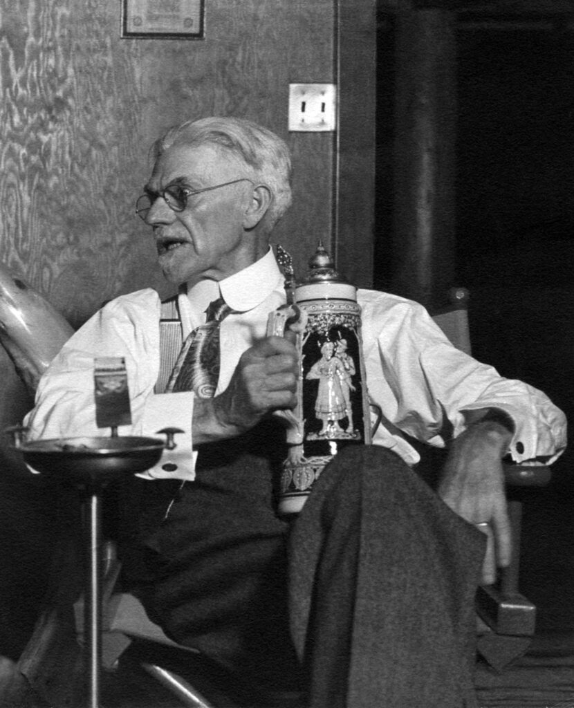 A black and white photo of Frank Ira Sefrit sitting with a beer stein.