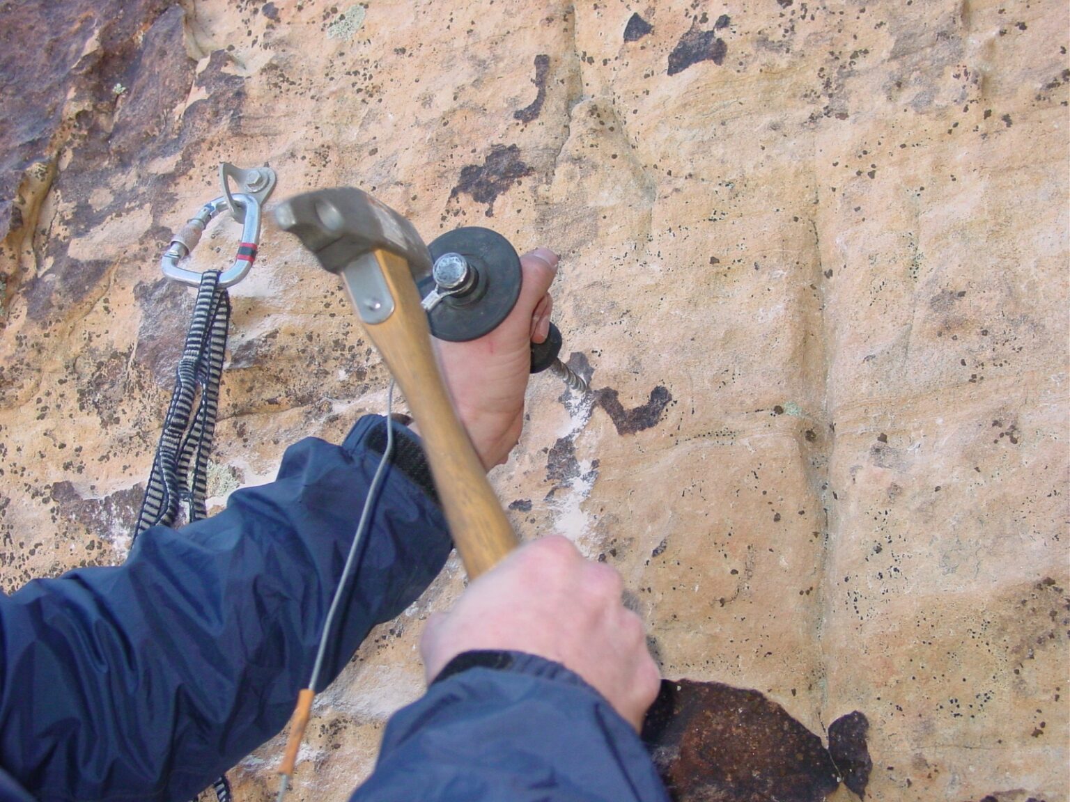 A climber uses a hand drill to place a bolt in the federally designated wilderness of Red Rock Canyon National Conservation Area near Las Vegas.