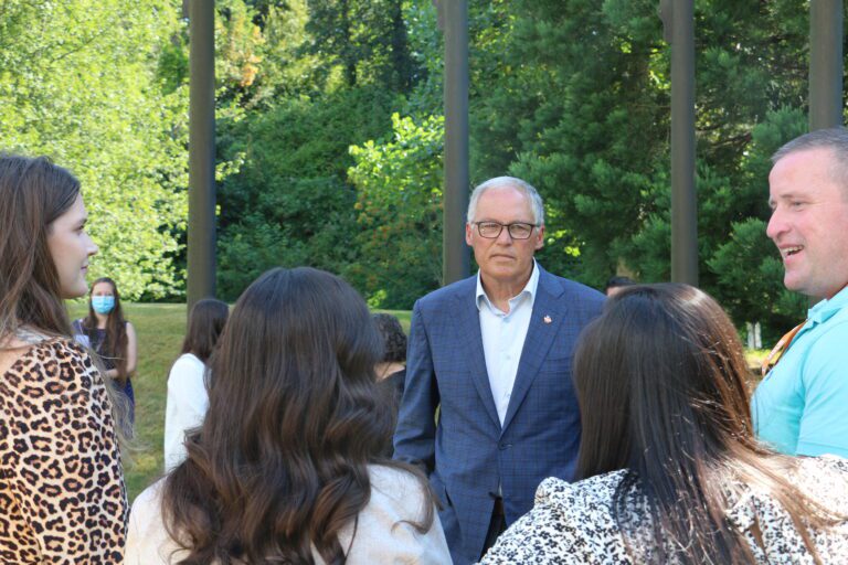 Gov. Jay Inslee speaks to a group of Volunteers of America employees at a 988 press conference on July 28