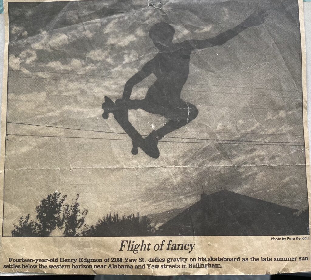 A photograph of 14-year-old Henry King (formerly Edgmon) doing a skateboard trick.