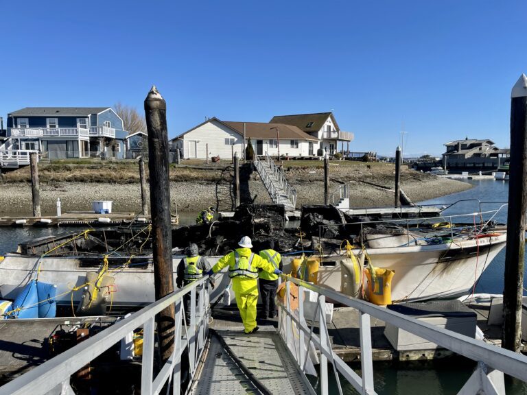 Cleanup crews are working to contain an oil spill caused by last week's boat fire. NRC