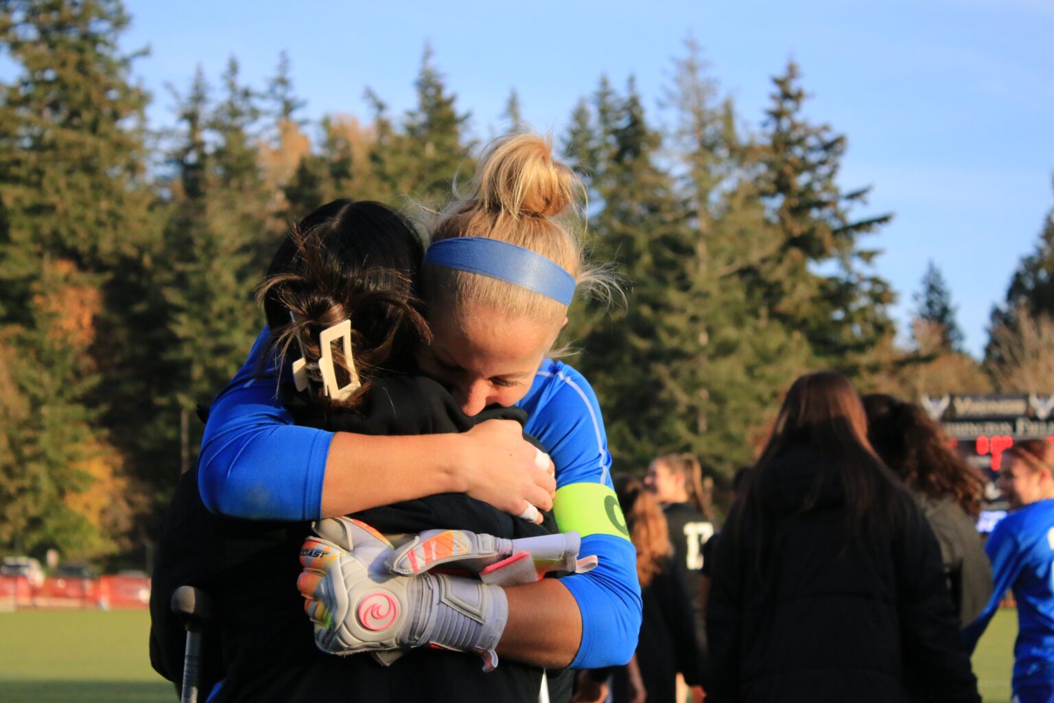 Fifth-year senior goalkeeper Claire Henninger embraces sophomore midfielder Ashley Nguyen following Western’s 3-1 win Saturday