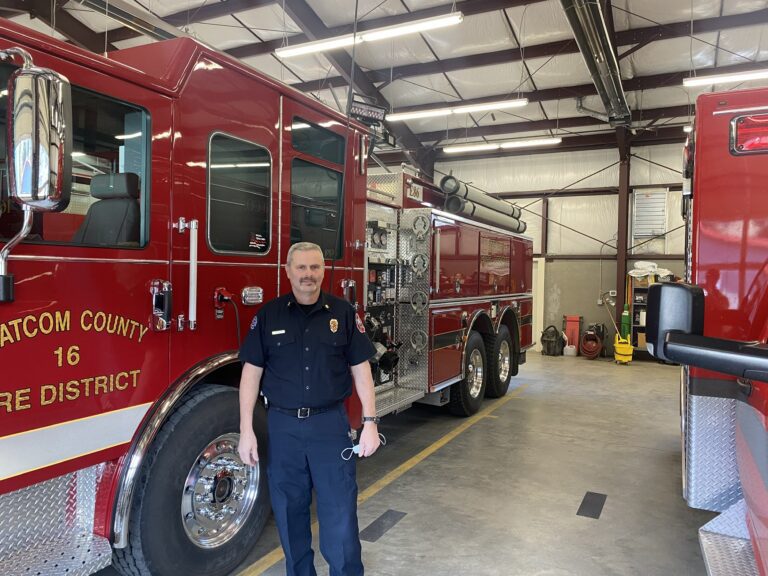 Fire Station 86's volunteer chief Hank Maleng stands next to one of the trucks that was recently robbed in Acme Washington.