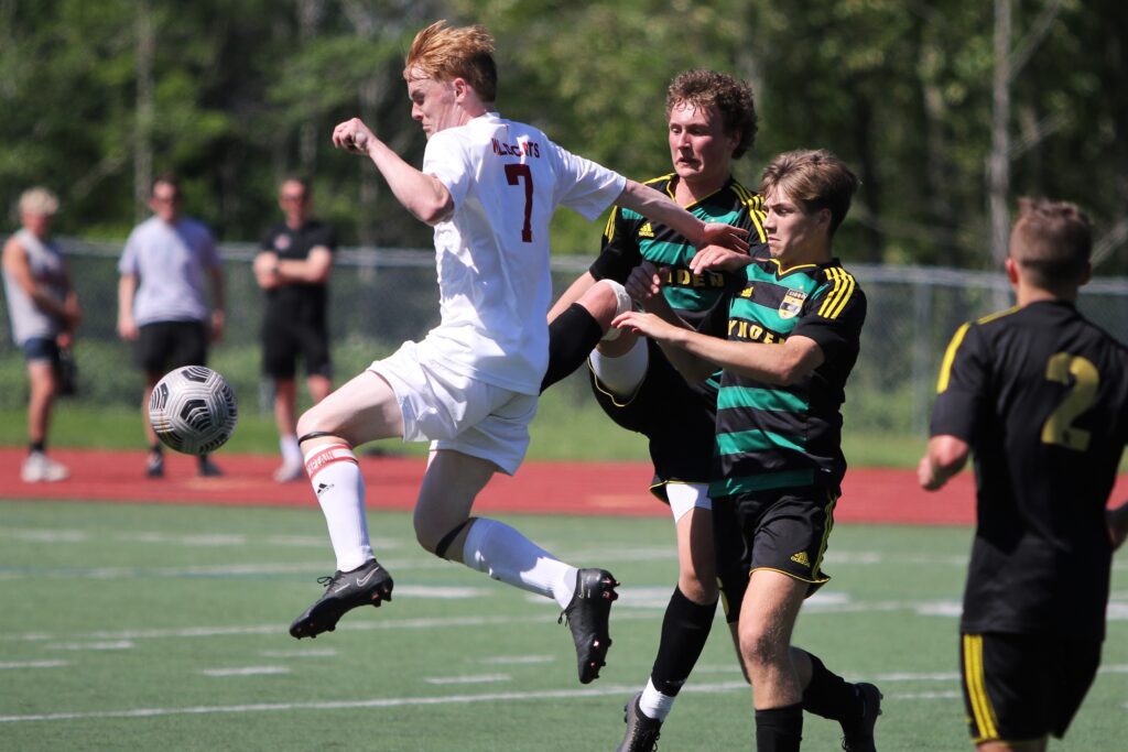 Archbishop Murphy's Sean Balen is met by Lynden's Dillon LeMay, middle, and Maximilian Jones while jumping up for the ball as all three battle for control of the ball.