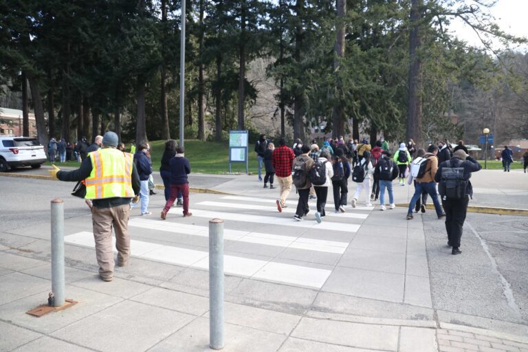 Students evacuate Viking Union at Western Washington University after the university received threats.