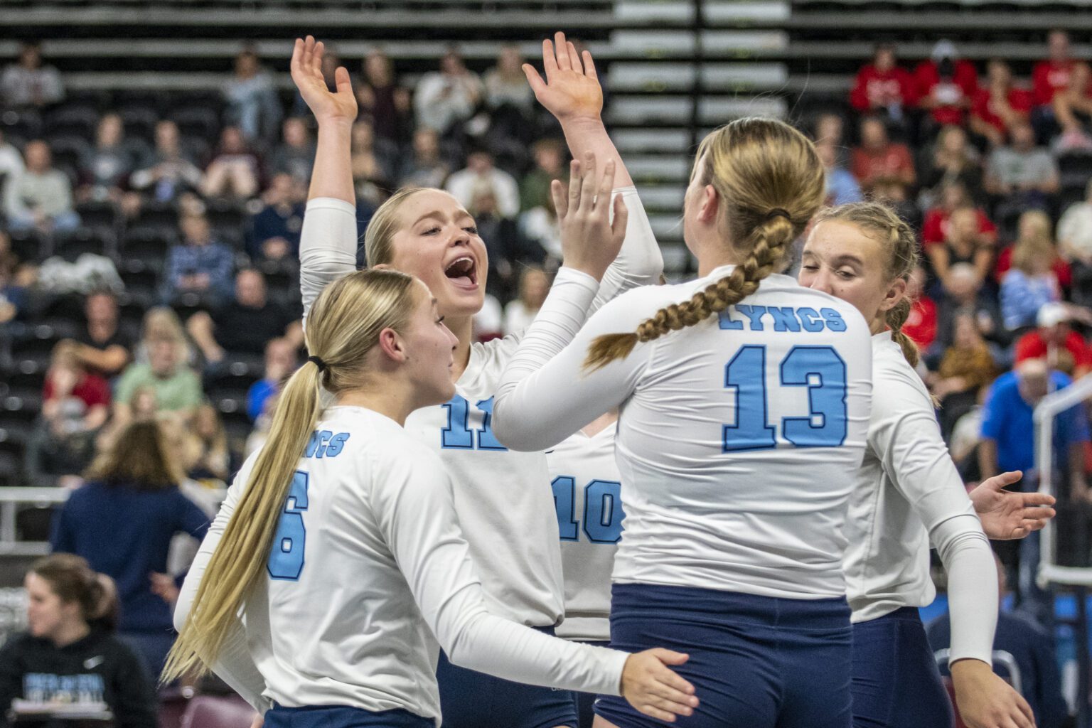 Lynden Christian's Reganne Arnold (11) throws her hands up in celebration during a 1A state tournament match against La Salle on Nov. 11.