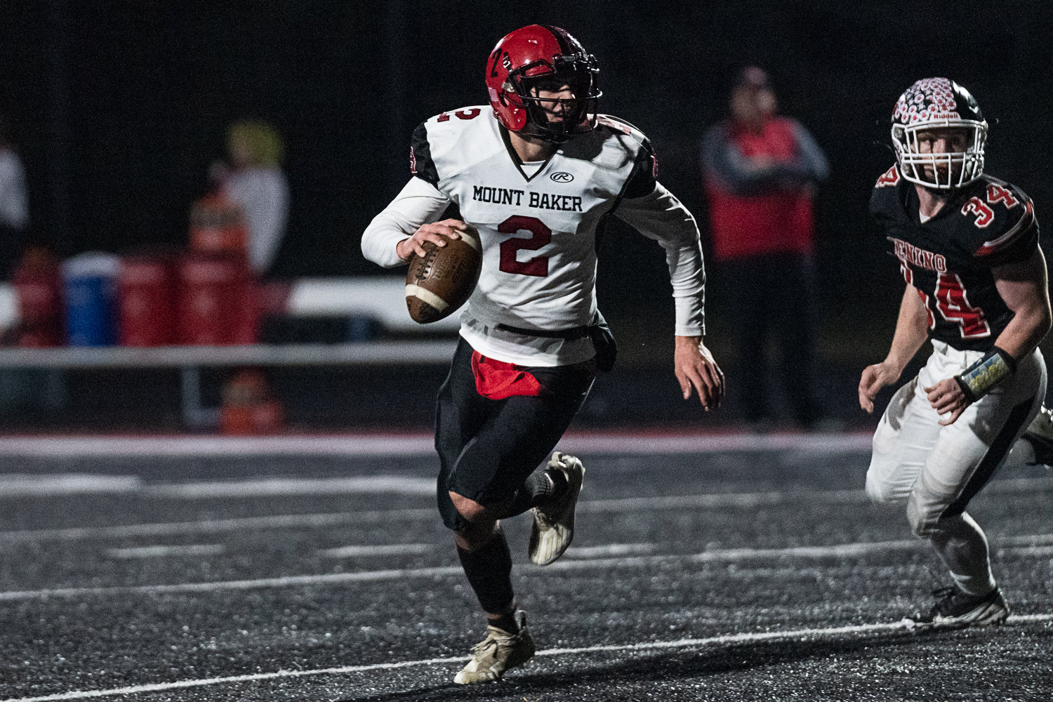 Mount Baker quarterback Landon Smith runs to the outside against Tenino in the first round of the 1A state tournament on Nov. 11. The Mountaineers won 37-26.