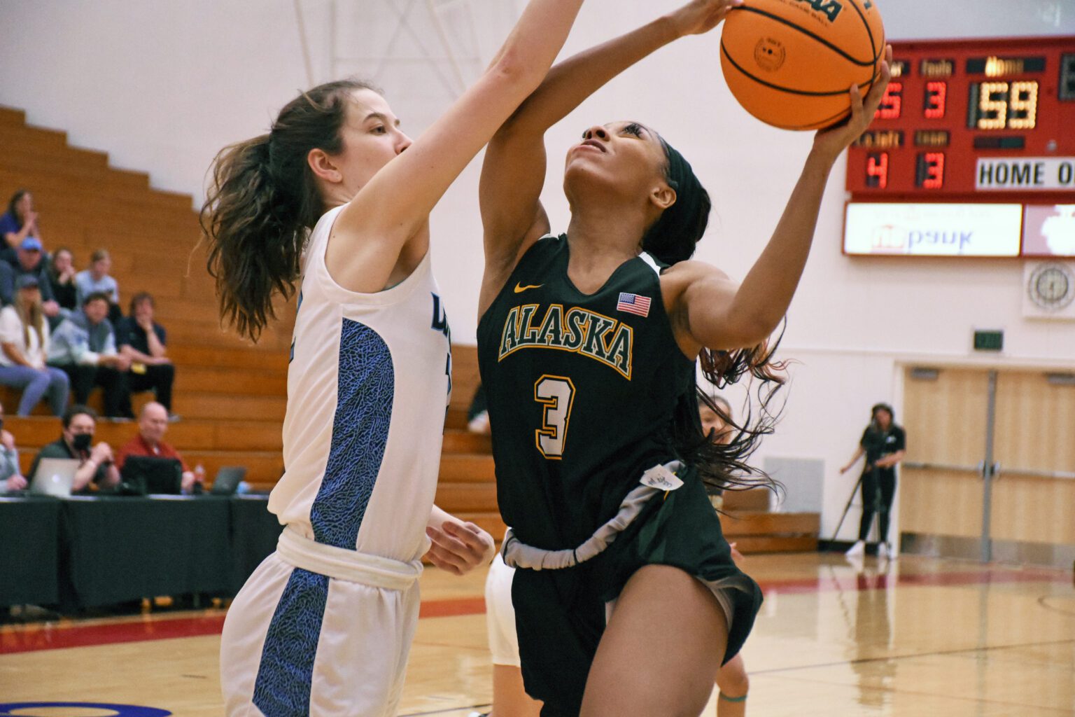 Alaska Anchorage senior guard Lauren Johnson squares off against Western's Emma Duff in tournament action Friday. The Vikings beat Alaska-Anchorage 76-64 to advance in the NCAA Division II women's tournament.
