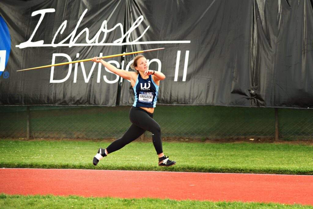Monika Gruszecki throwing a javelin.