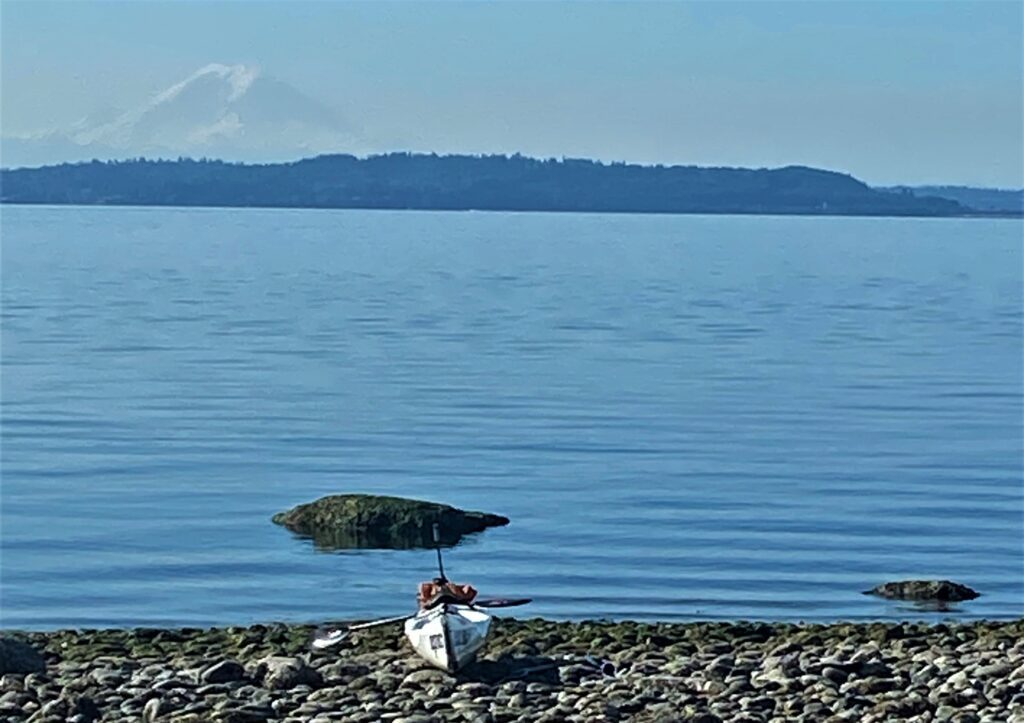Paddlers Bart Maupin and Marc Fuhrmeister took a break at Point Jefferson south of Kingston with Mount Rainier in the background.