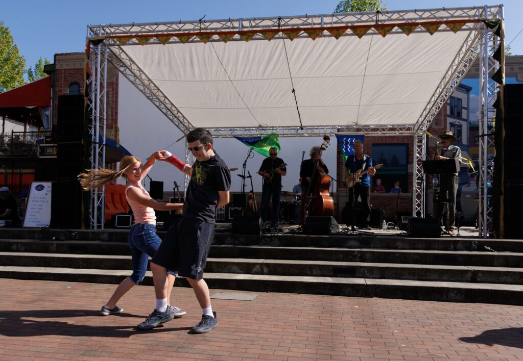 Heidi Koepp and Carter Johnson dance to the music during the Fairhaven Festival.